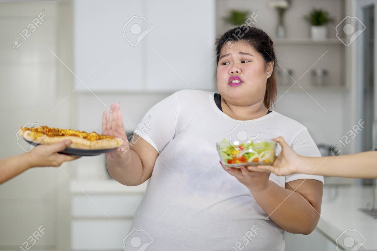 bassam helmy add fat lady eating pizza photo