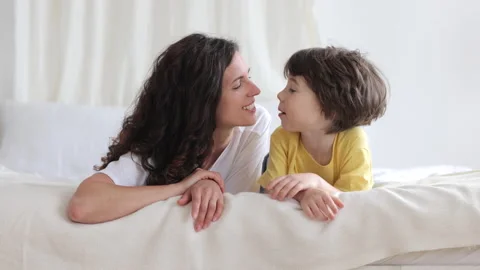 mom and boy in bed