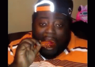 black man eating chicken gif
