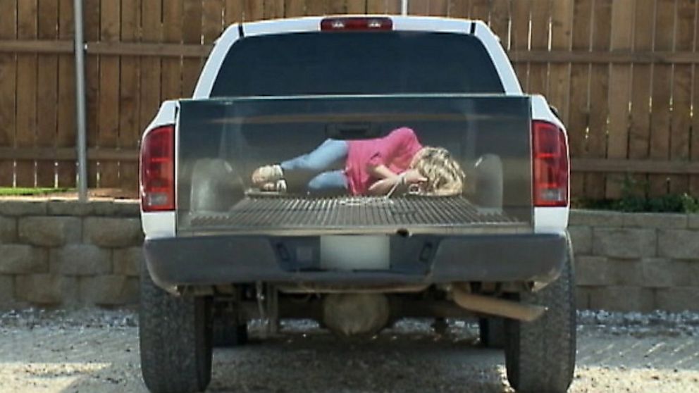 Best of Woman tied to front of truck